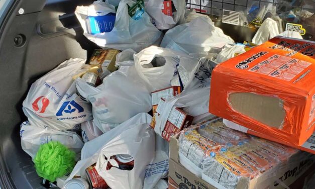 Police, Explorers hold ‘Fill the Patrol Car’ food drive to benefit Tukwila Food Pantry